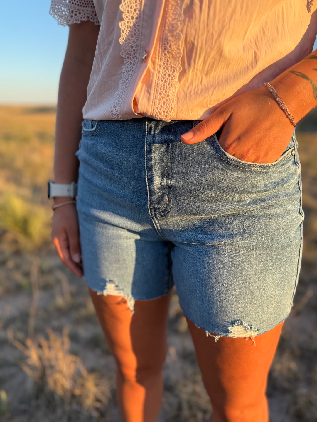 Medium Wash Mid Length Distressed Cut Off Shorts