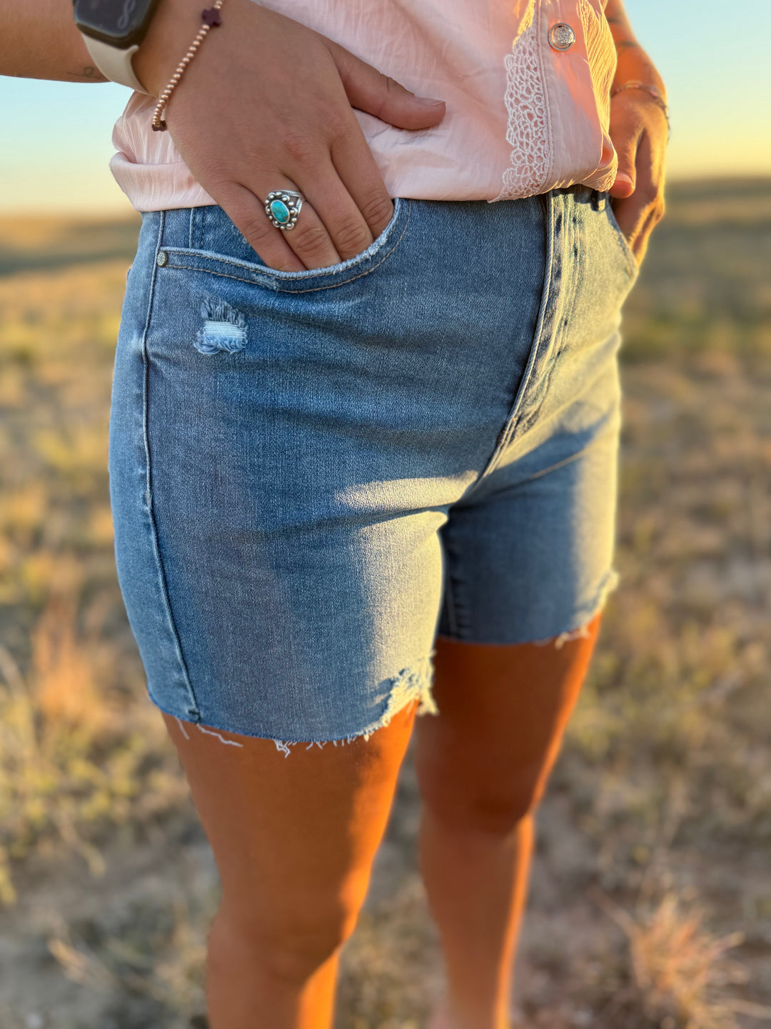 Medium Wash Mid Length Distressed Cut Off Shorts