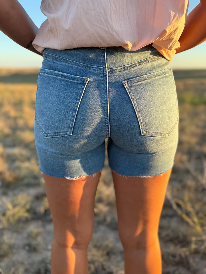Medium Wash Mid Length Distressed Cut Off Shorts