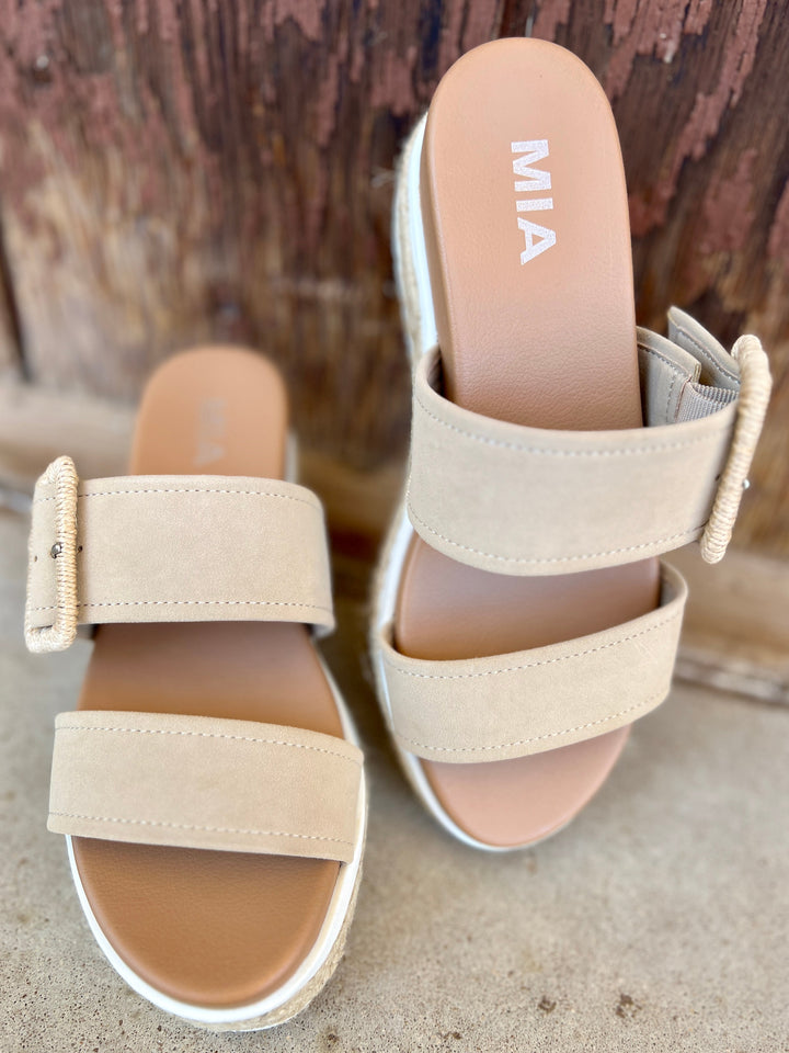 Suede Sand Raffia Platform Sandals | Gussied Up Online Suede sandal. Platform sandal. Neutral color sandal. Fashion trends. Women's shoes. Women's sandals. Women's style. Casual sandal. Women's casual footwear. Spring shoes. Summer shoes. Raffia sandals. Comfortable women's platform sandals. Style. Shoes. Fashion.
