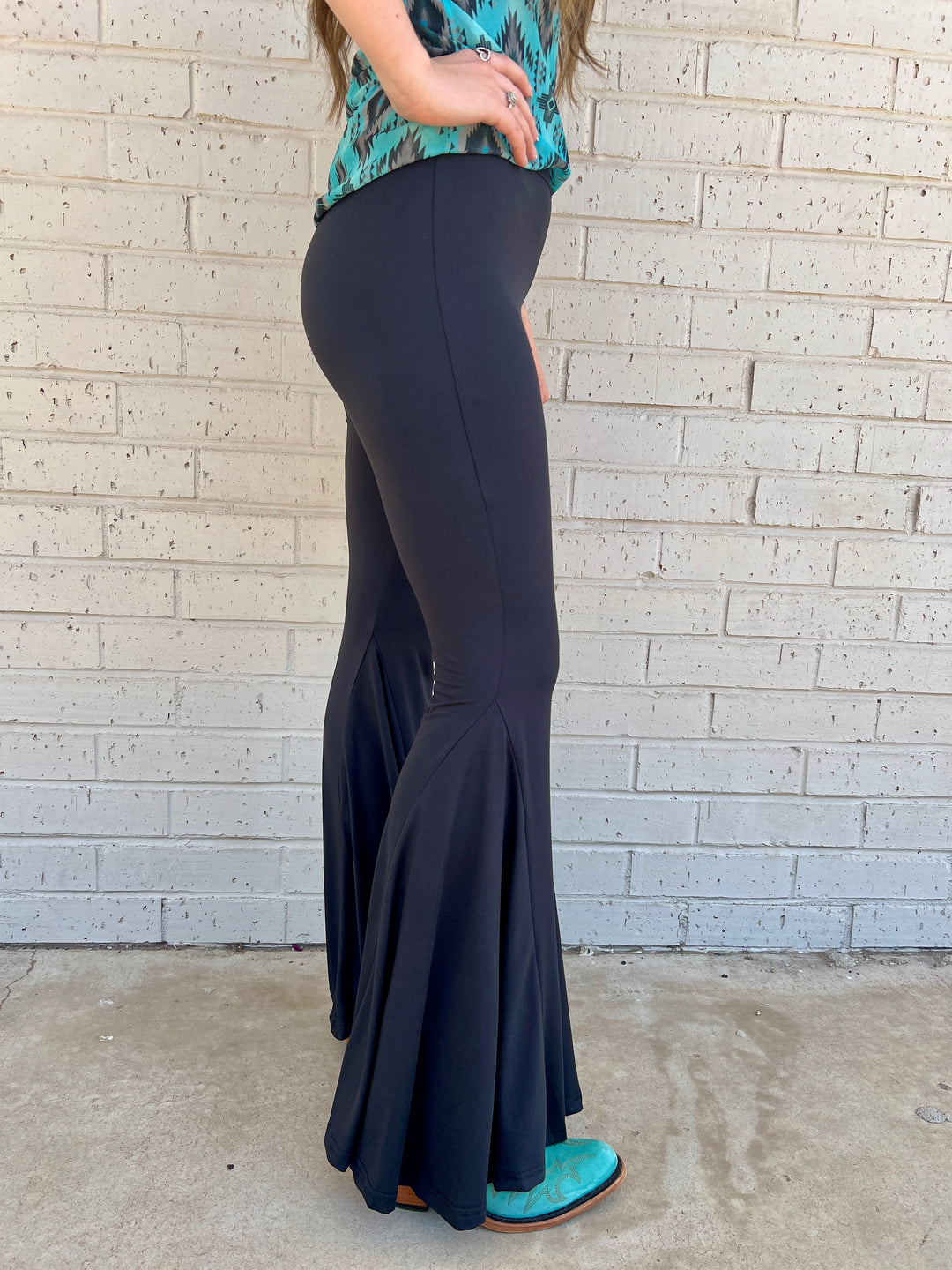 Sterling Kreek Bell Bottoms. Bell Bottoms. black pants. High waisted pants. black Bell bottoms. Stretchy pants. Comfortable pants. Western style. Women's western wear. Women's black pants. Women's western boutique. Women's western wear. Online boutique. Small business. Woman owned. 