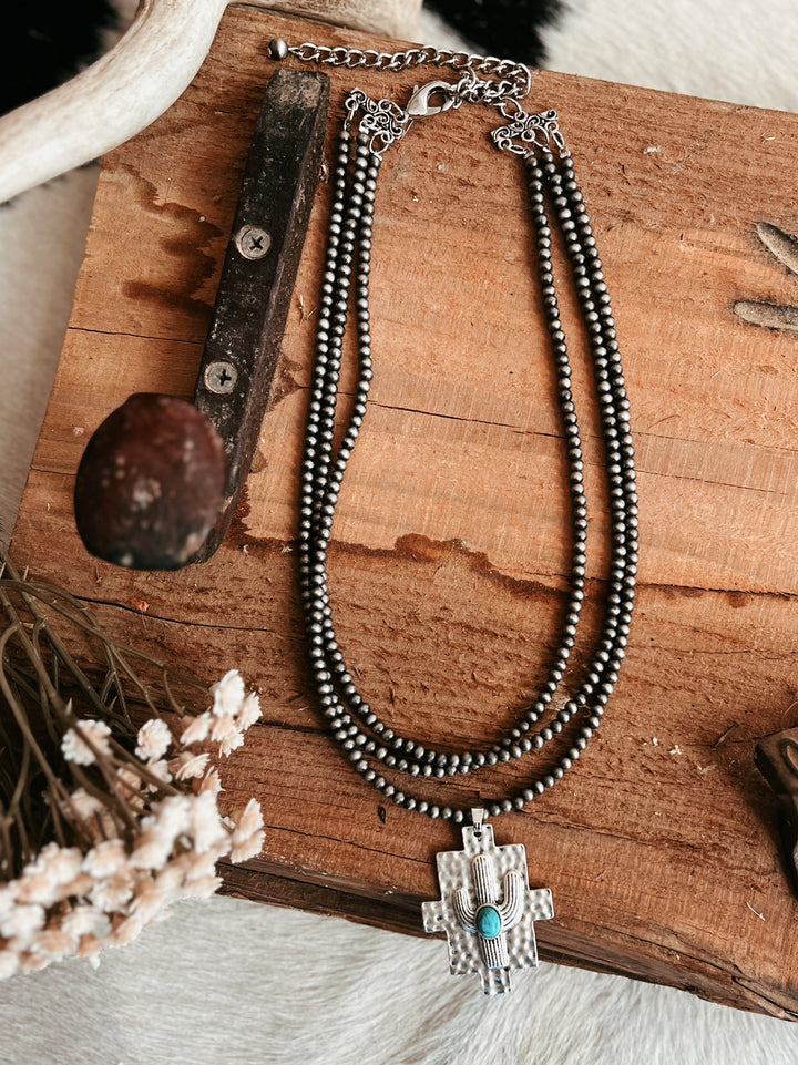 Multi-Strand Navajo Pearl Strand Necklace With A Cactus Pendant | gussieduponline