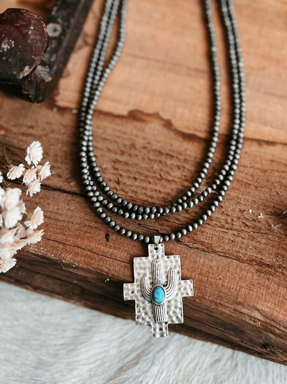 Multi-Strand Navajo Pearl Strand Necklace With A Cactus Pendant | gussieduponline