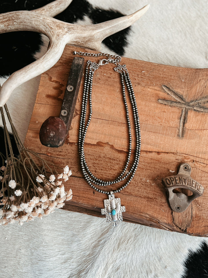 Multi-Strand Navajo Pearl Strand Necklace With A Cactus Pendant | gussieduponline
